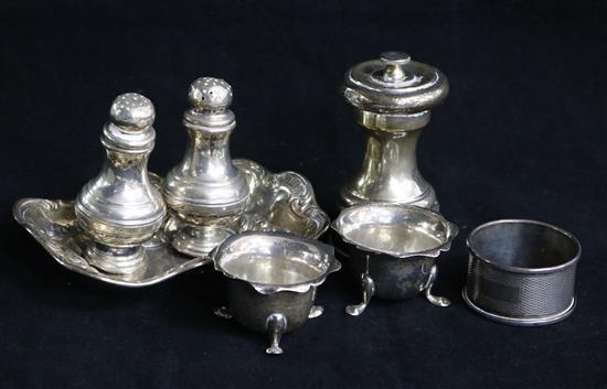 Two cauldron salts, a pepper mill, two .800 standard pepper pots, a napkin ring and a bon bon dish.